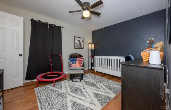 a view of a room with furniture and a potted plant