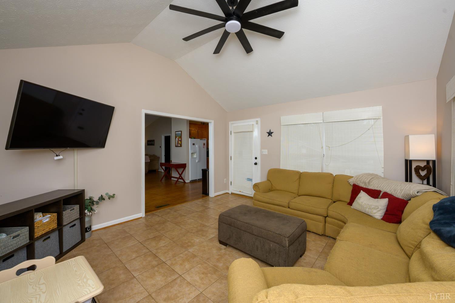 151 Wilderness Road Rustburg, VA 24588 - Photo 34 of 63 a living room with furniture and a flat screen tv