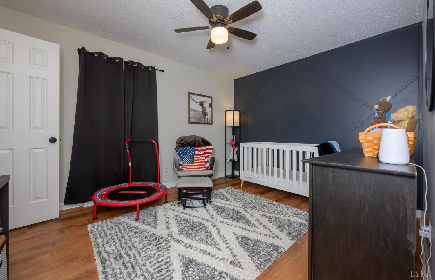 151 Wilderness Road Rustburg, VA 24588 - Photo 40 of 63 a bedroom with furniture and a rug