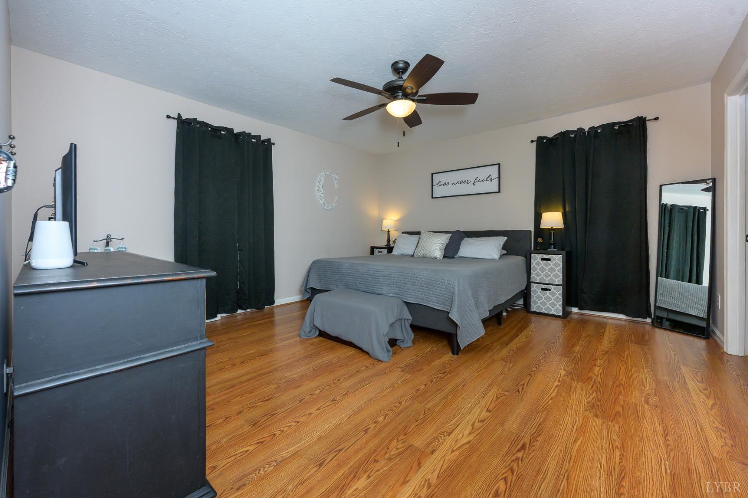 151 Wilderness Road Rustburg, VA 24588 - Photo 44 of 63 a bedroom with a bed and a refrigerator