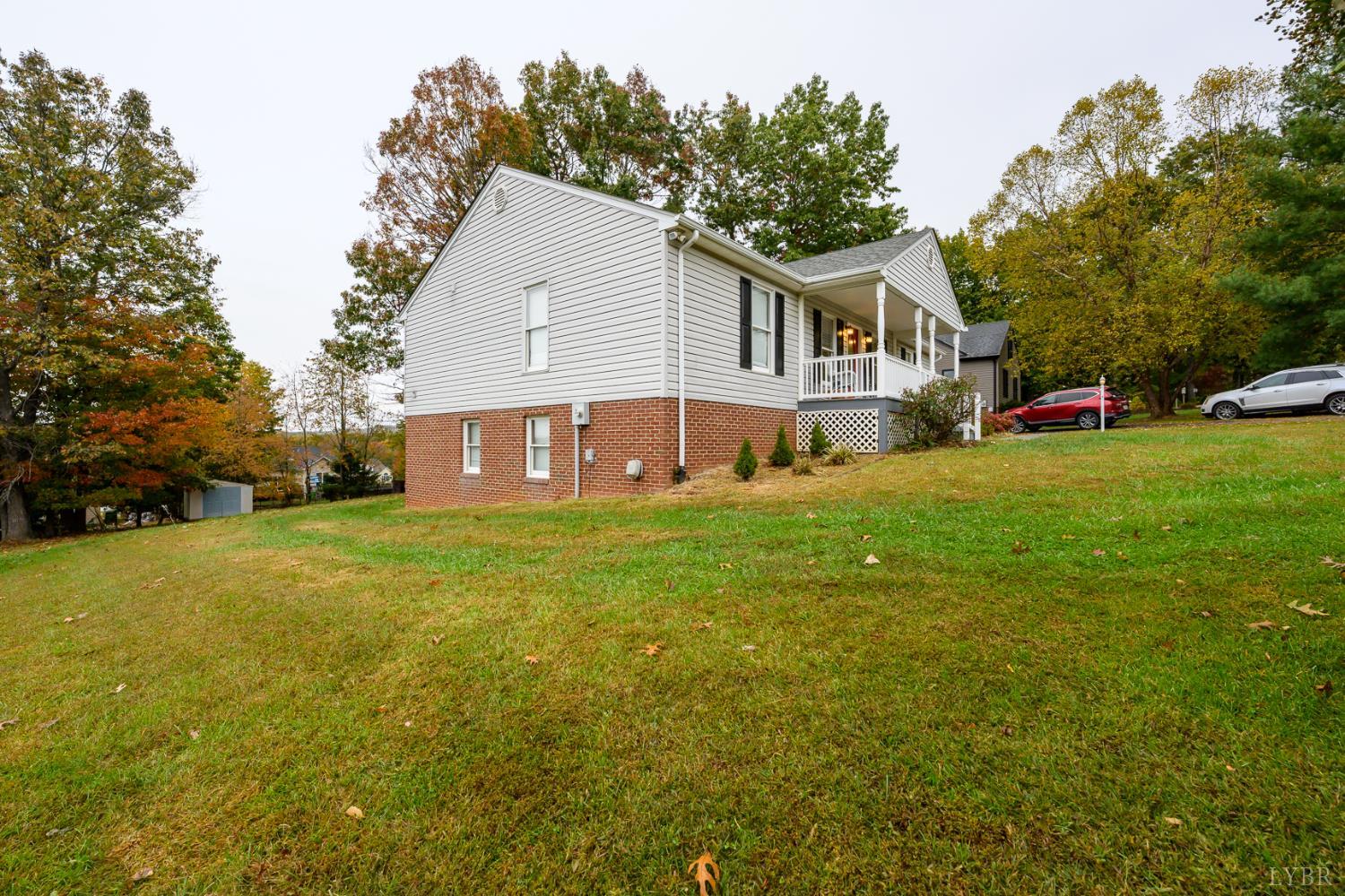 151 Wilderness Road Rustburg, VA 24588 - Photo 45 of 63 a view of a house with a yard and sitting area