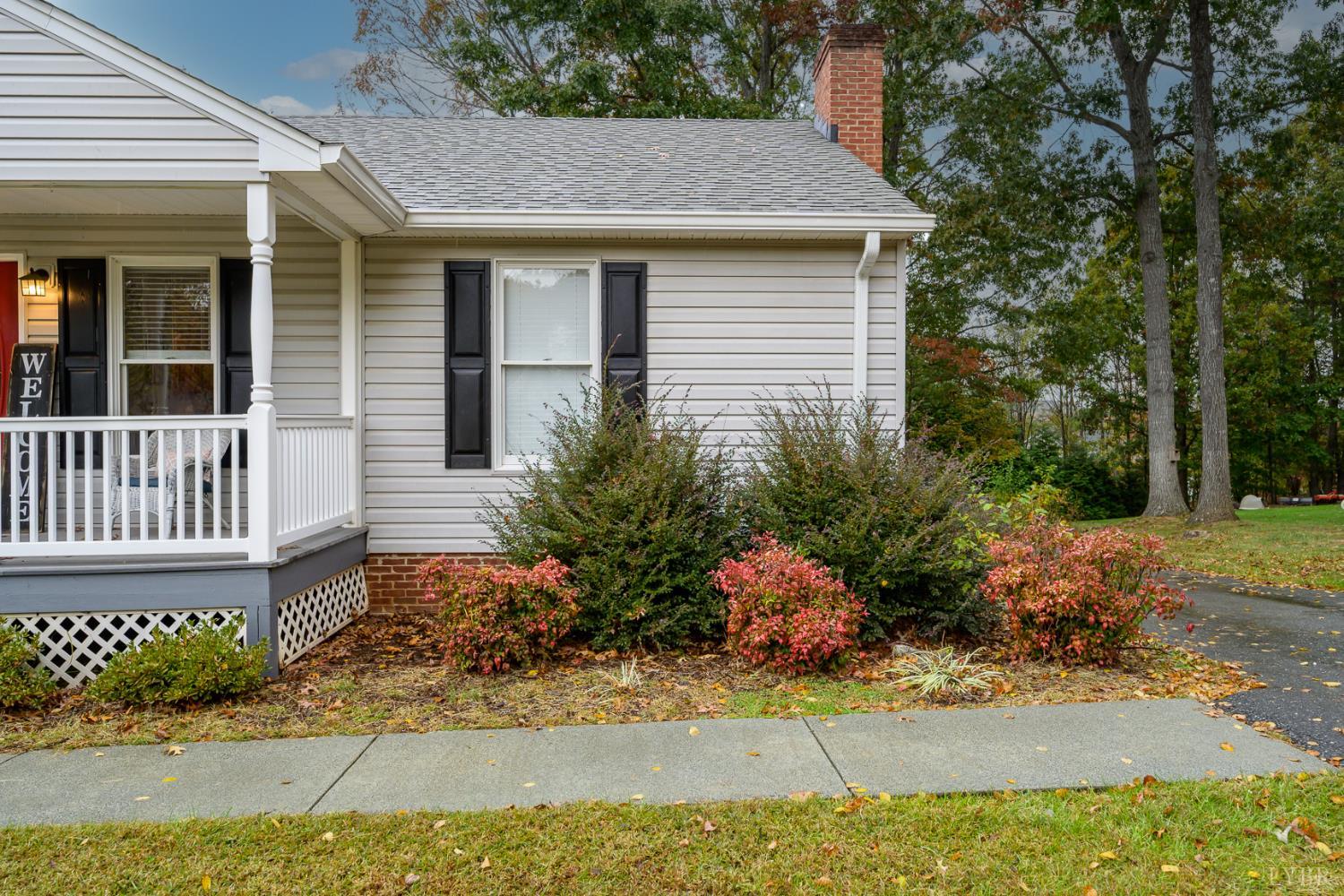 151 Wilderness Road Rustburg, VA 24588 - Photo 48 of 63 a front view of a house with a yard