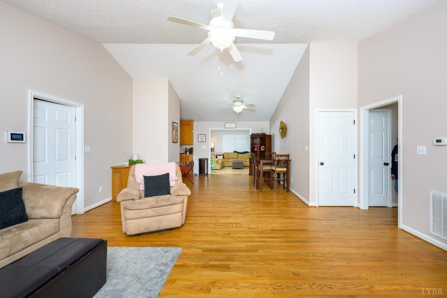 151 Wilderness Road Rustburg, VA 24588 - Photo 57 of 63 a living room with furniture and wooden floor