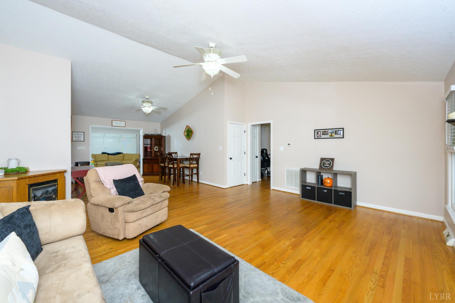 151 Wilderness Road Rustburg, VA 24588 - Photo 58 of 63 a living room with furniture and a table with potted plants