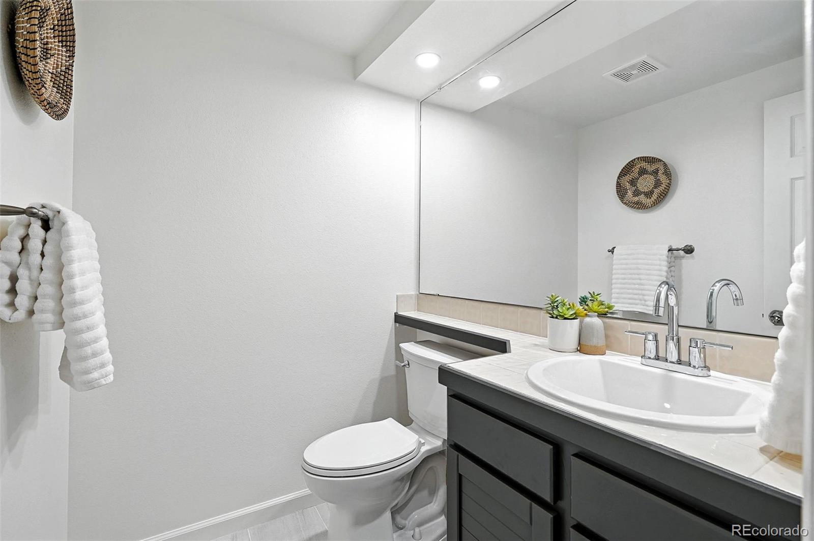 9400 East Iliff Avenue, Unit 321 Denver, CO 80231 - Photo 19 of 44 a bathroom with a sink and a toilet