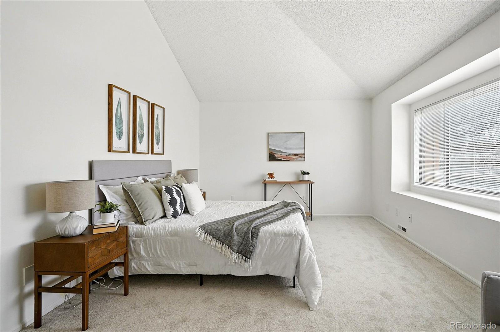 9400 East Iliff Avenue, Unit 321 Denver, CO 80231 - Photo 21 of 44 a bed room with furniture and a window