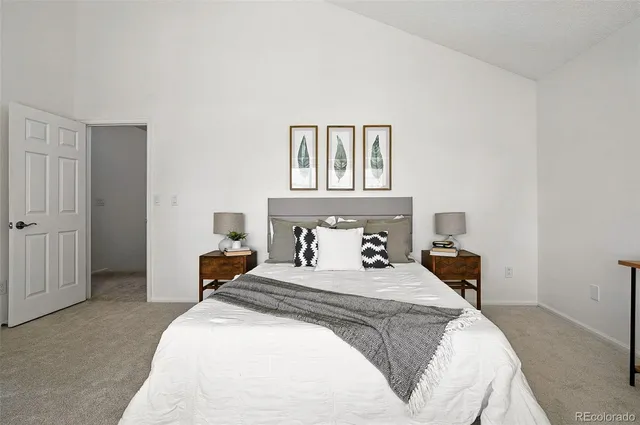 a bedroom with a bed and a table in it