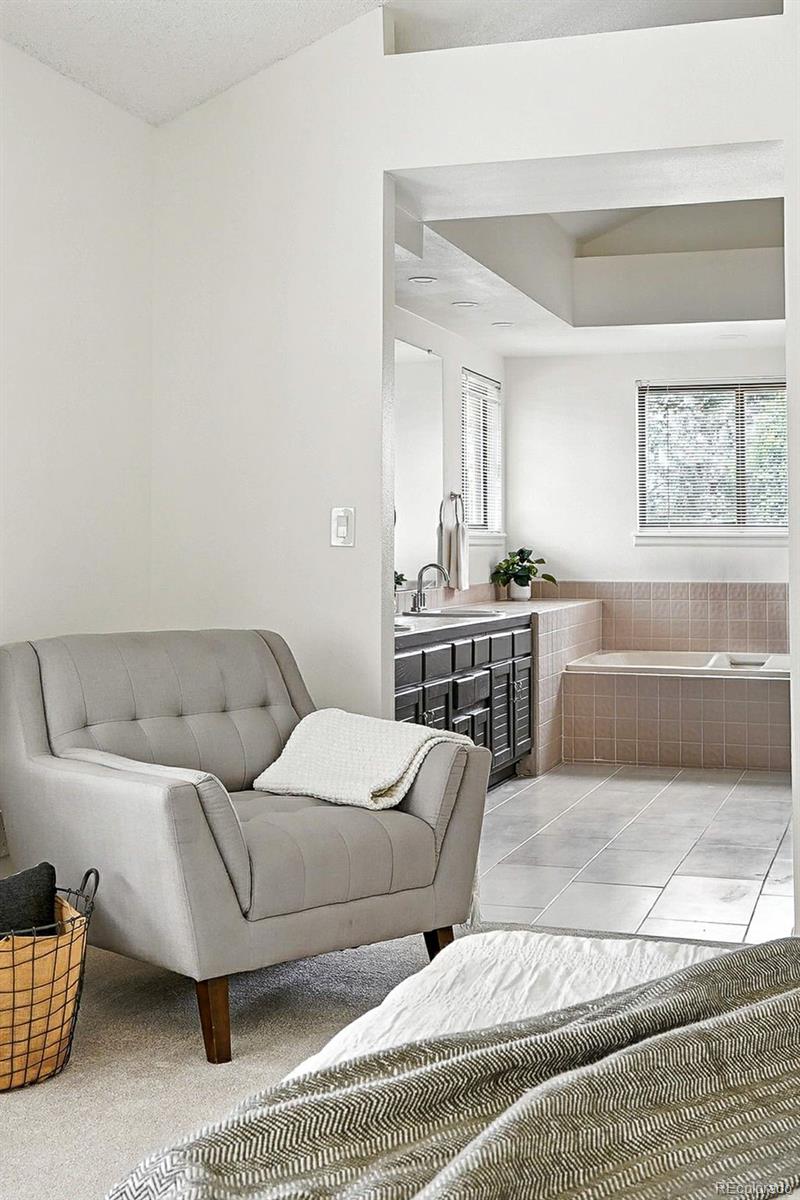 9400 East Iliff Avenue, Unit 321 Denver, CO 80231 - Photo 24 of 44 a living room with furniture and a couch