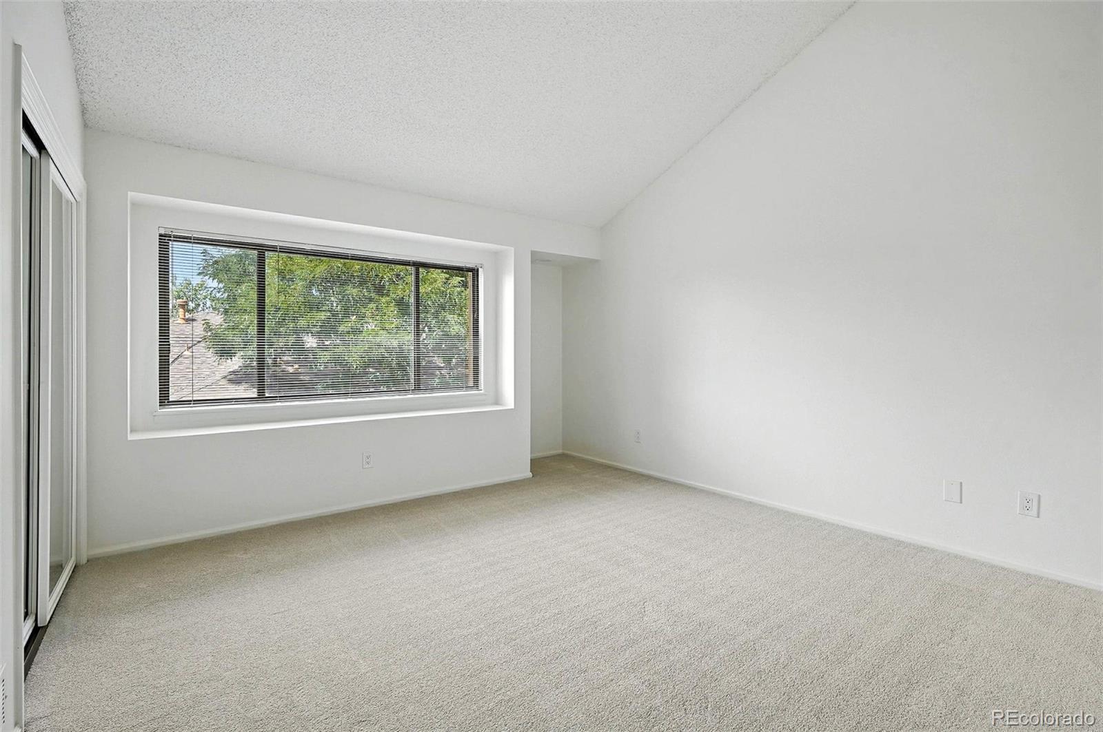 9400 East Iliff Avenue, Unit 321 Denver, CO 80231 - Photo 30 of 44 an empty room with windows