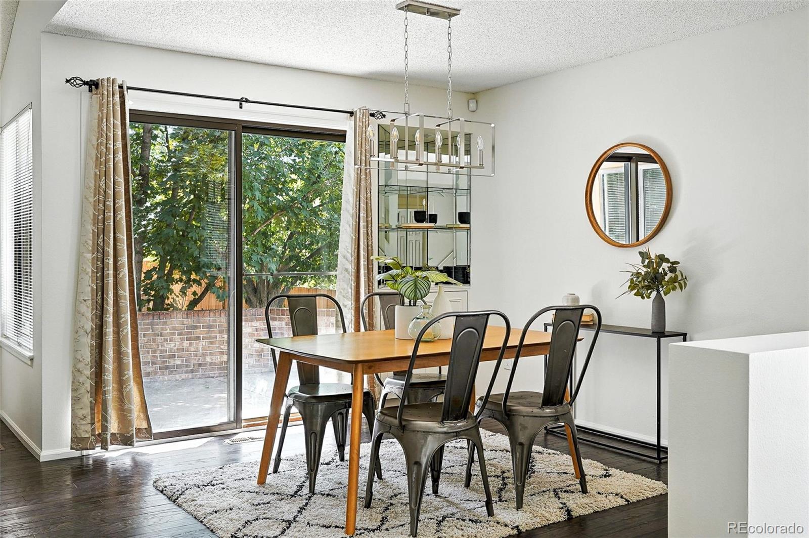 9400 East Iliff Avenue, Unit 321 Denver, CO 80231 - Photo 7 of 44 a dining room with furniture window wooden floor