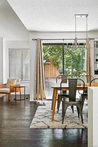 a view of a dining room with furniture window and wooden floor