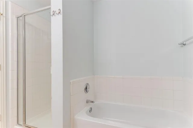 a bathroom with a double vanity sink toilet and mirror