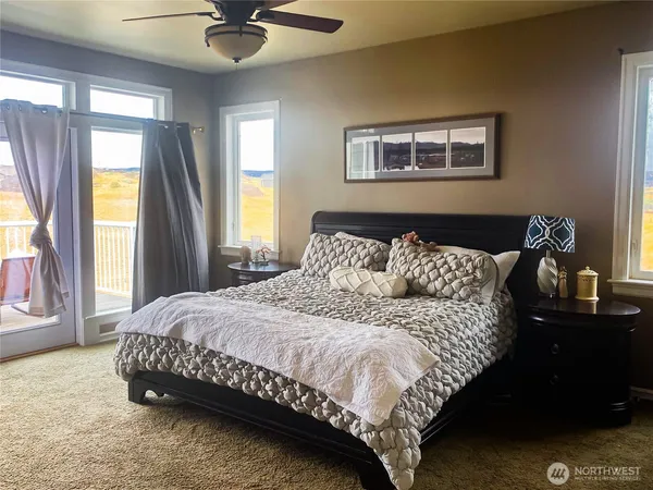 a bedroom with a bed and window