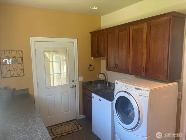 a utility room with dryer and washer