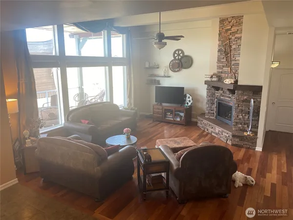 a living room with furniture and a fireplace