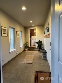 a view of a livingroom with couch and a window
