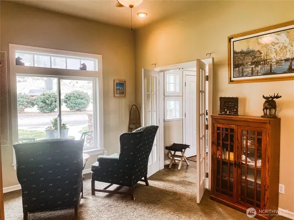 a living room with furniture and a window