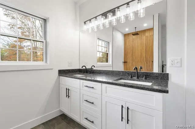 an empty room with closet and a ceiling fan