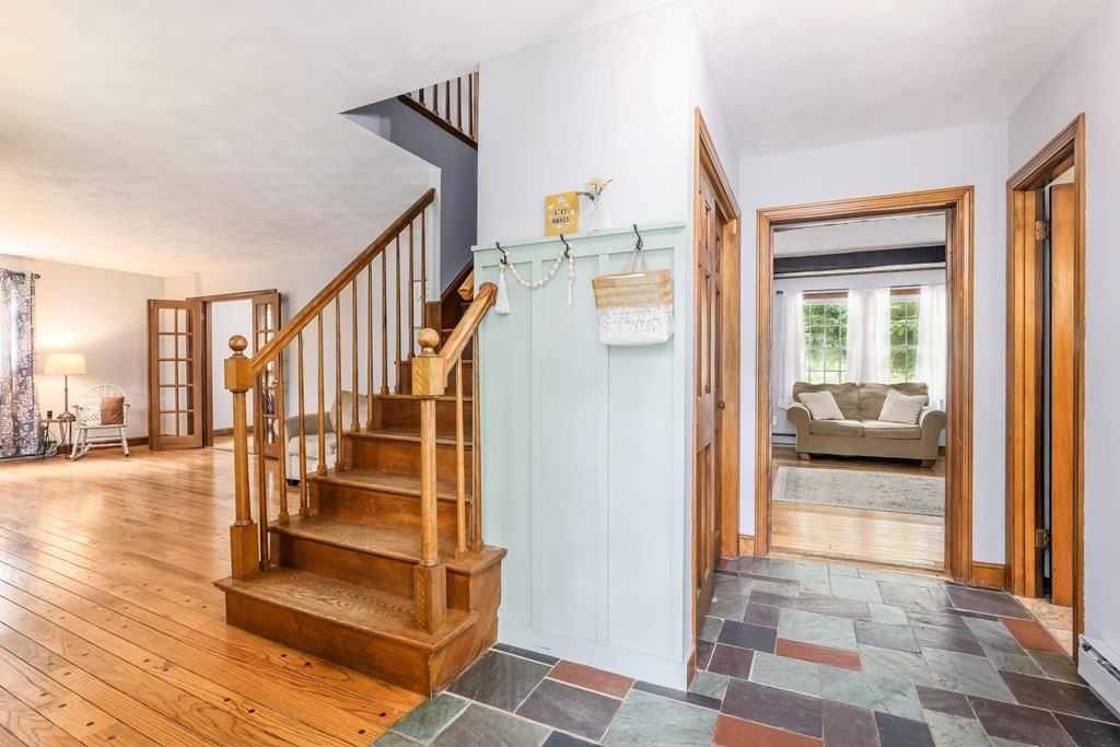 200 West Sutton Road Sutton, MA 01590 - Photo 5 of 33 a view of a hallway with wooden floor and windows