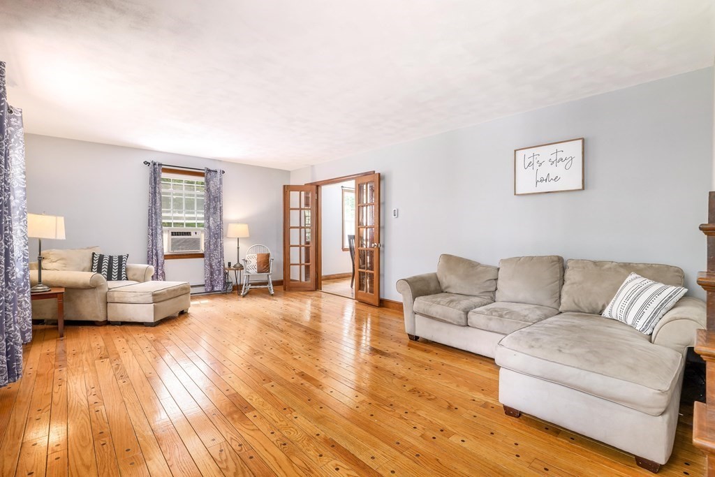 200 West Sutton Road Sutton, MA 01590 - Photo 8 of 33 a living room with furniture and a wooden floor