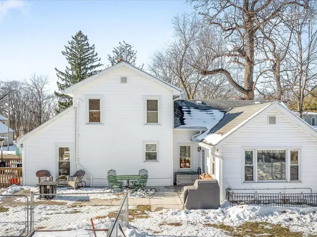 a front view of a house with snow