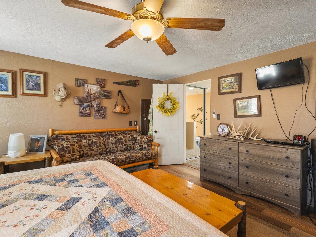 13005 Mitchell Street Shirland, IL 61079 - Photo 21 of 37 a bedroom with a bed and wooden floor