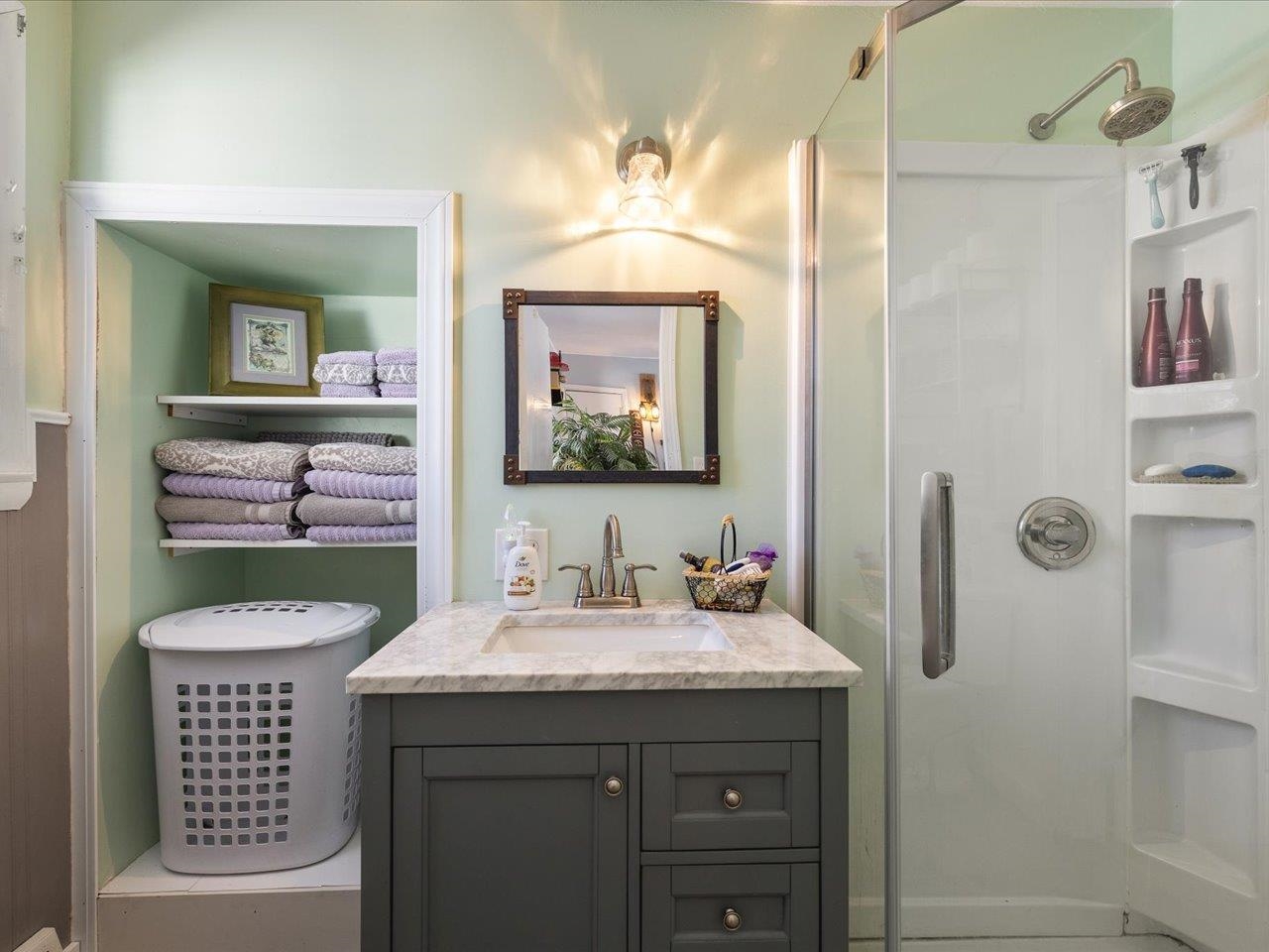 13005 Mitchell Street Shirland, IL 61079 - Photo 26 of 37 a bathroom with a sink and a mirror
