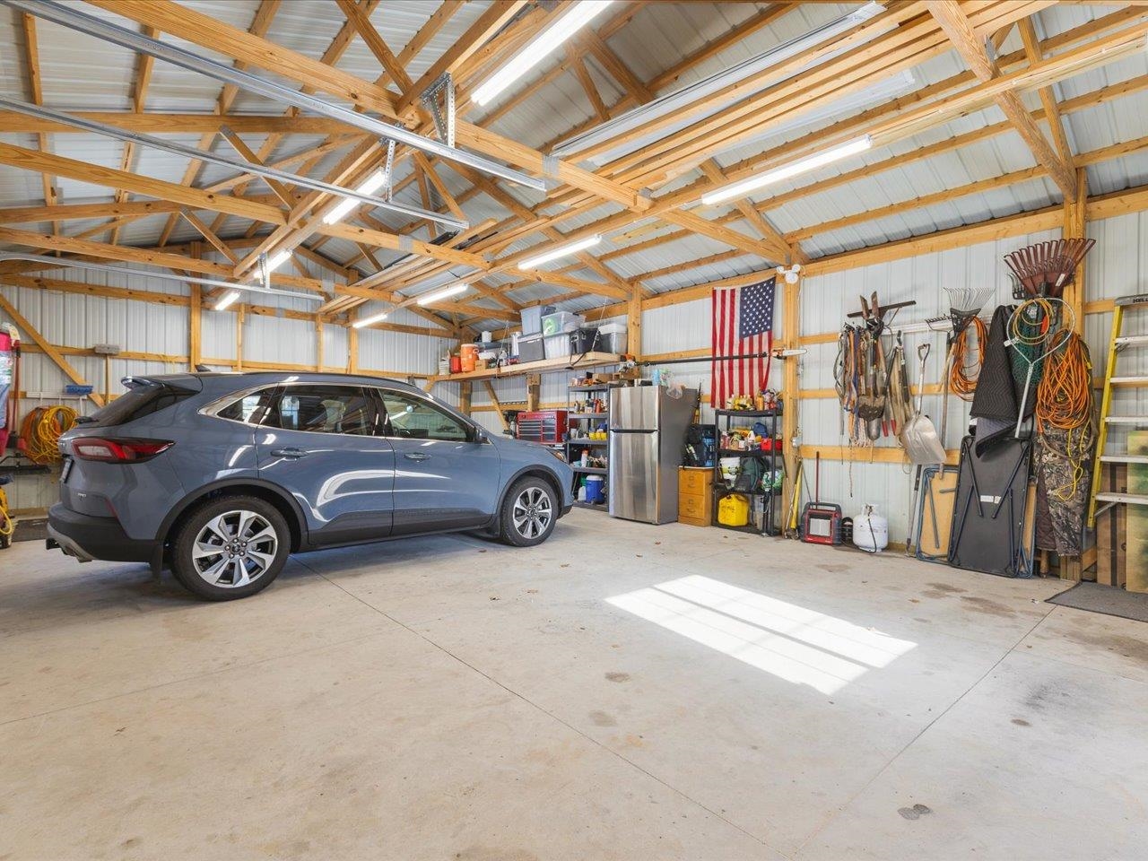 13005 Mitchell Street Shirland, IL 61079 - Photo 30 of 37 a view of a garage with a car and parked car