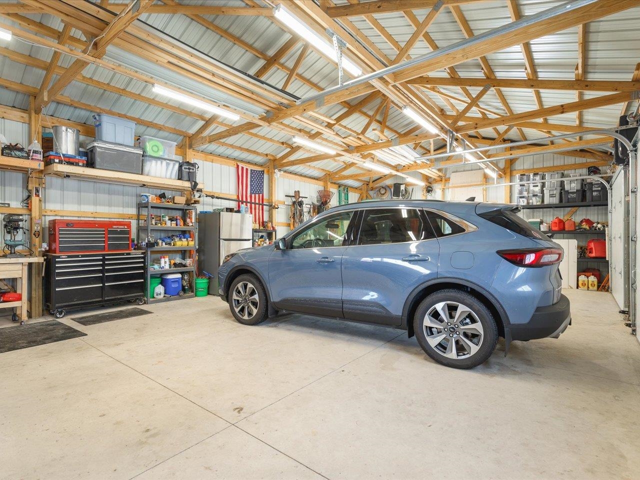 13005 Mitchell Street Shirland, IL 61079 - Photo 31 of 37 a view of parking garage with a car parked car
