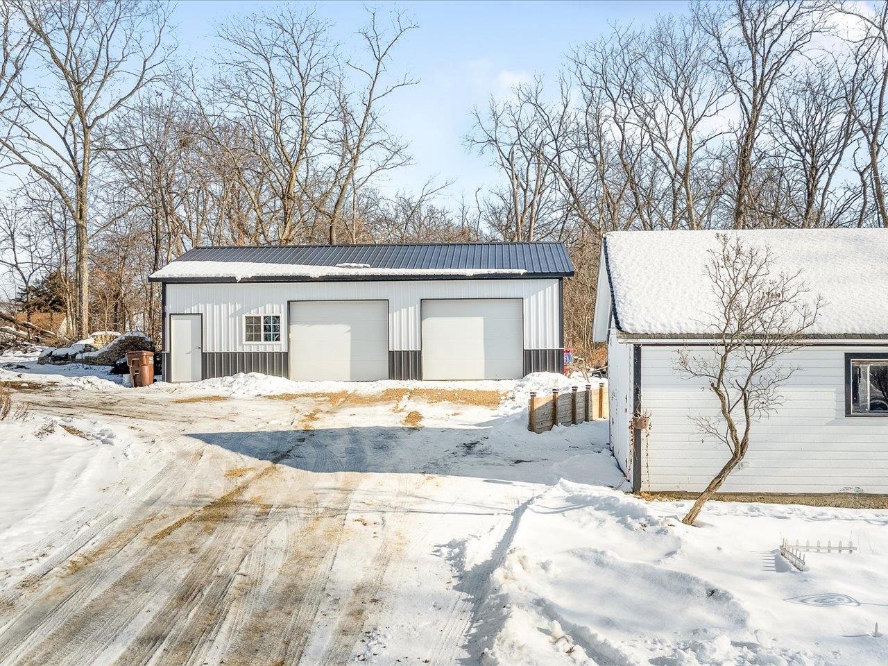 13005 Mitchell Street Shirland, IL 61079 - Photo 6 of 37 a view of a white house with snow on the road
