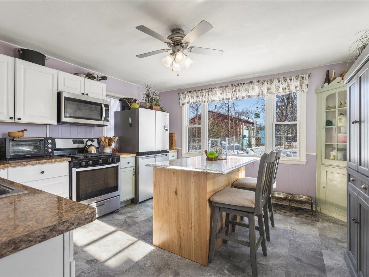 13005 Mitchell Street Shirland, IL 61079 - Photo 10 of 37 a kitchen with a table chairs refrigerator and cabinets