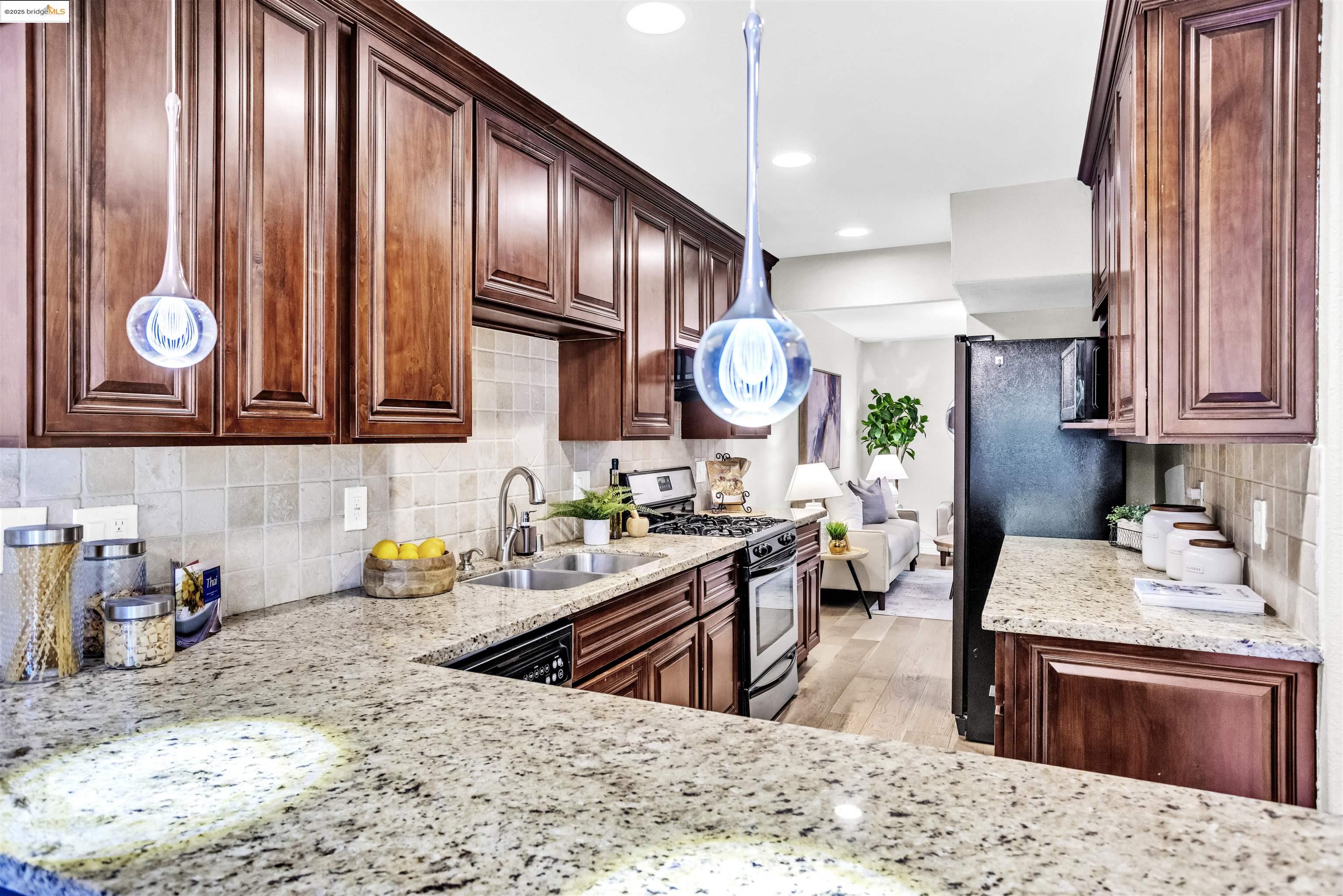 1905 Cannon Place Walnut Creek, CA 94597 - Photo 11 of 40 a kitchen with stainless steel appliances granite countertop a sink dishwasher stove and cabinets