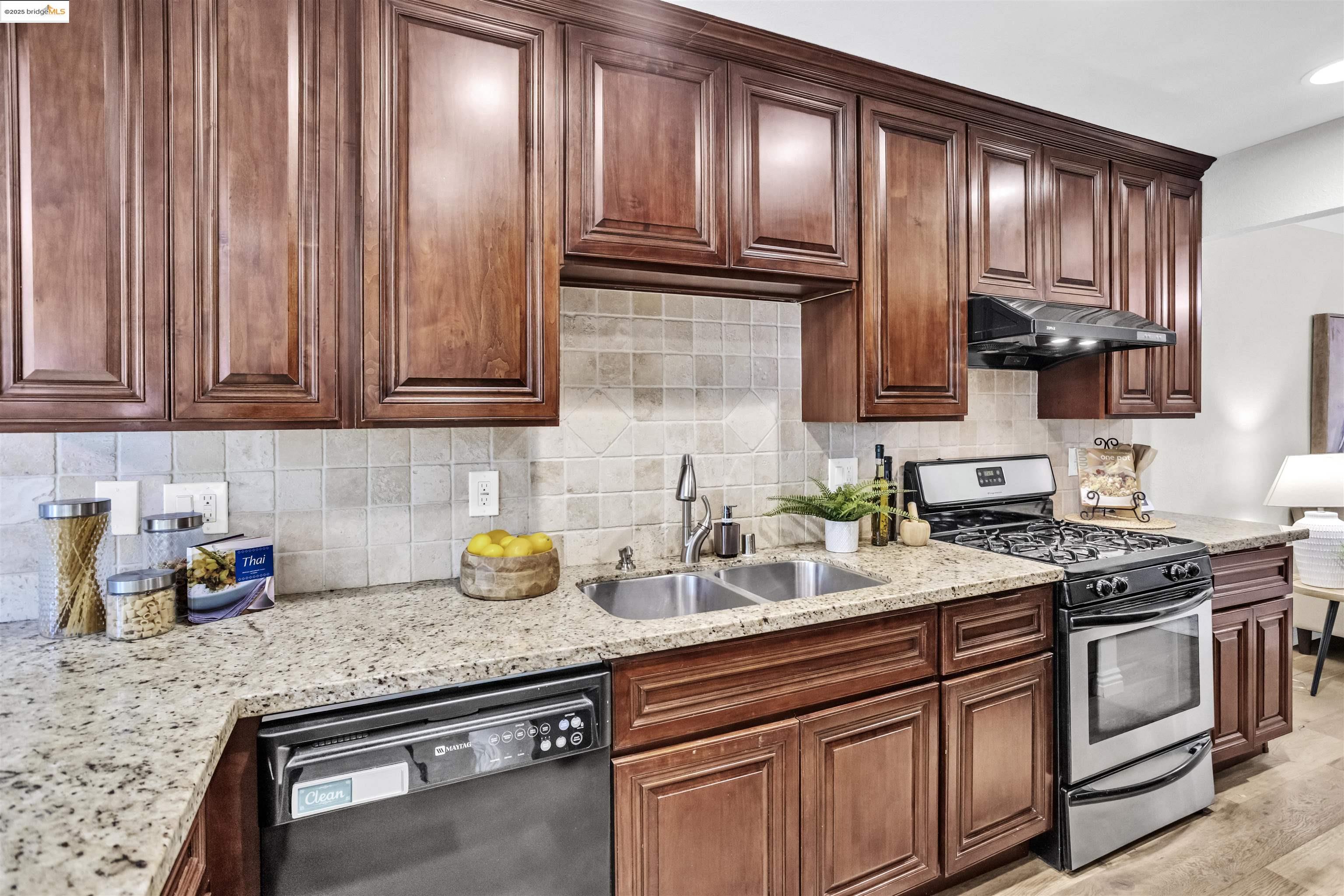 1905 Cannon Place Walnut Creek, CA 94597 - Photo 12 of 40 a kitchen with granite countertop stainless steel appliances a sink a stove and cabinets