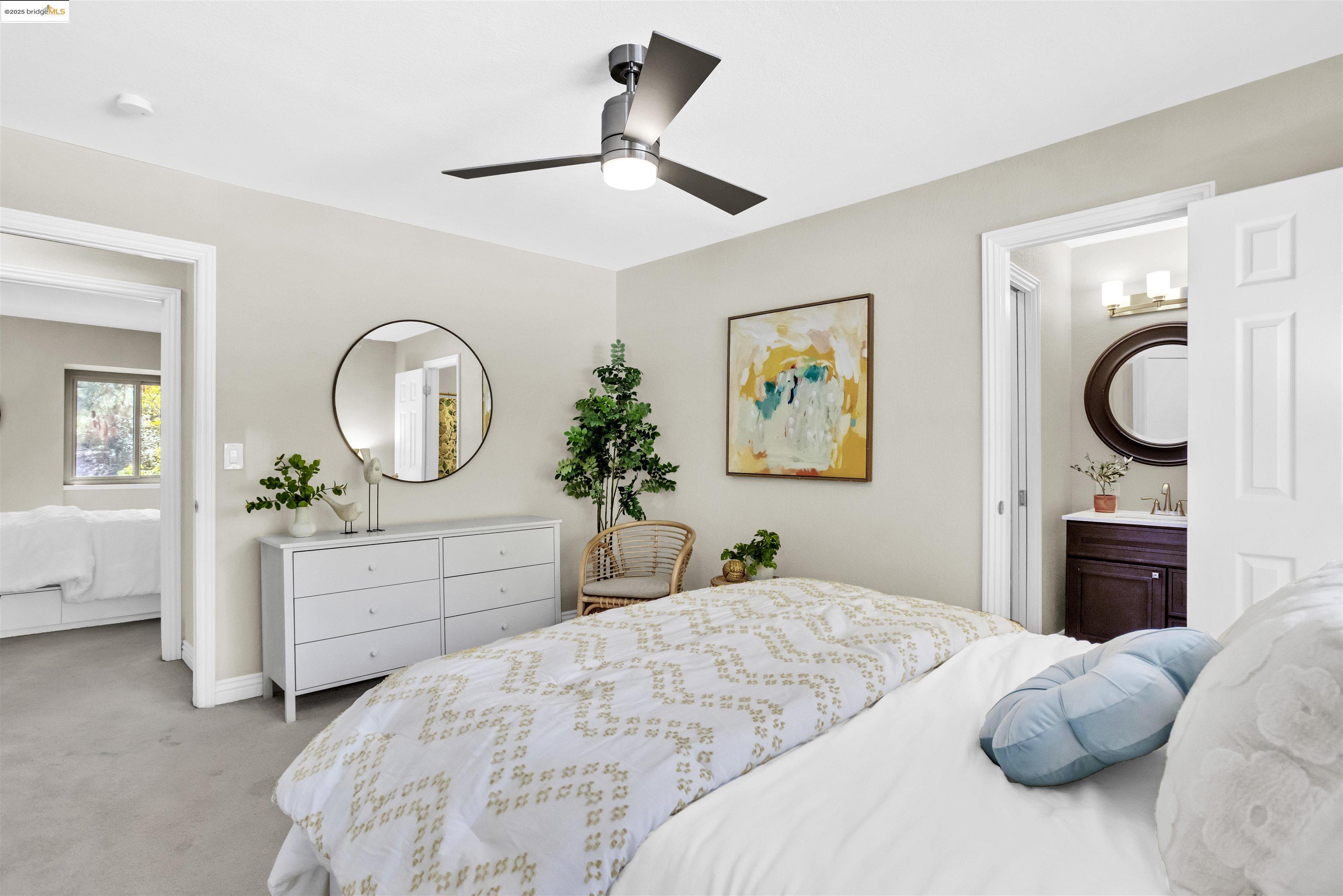 1905 Cannon Place Walnut Creek, CA 94597 - Photo 26 of 40 a bedroom with a large bed and a chandelier