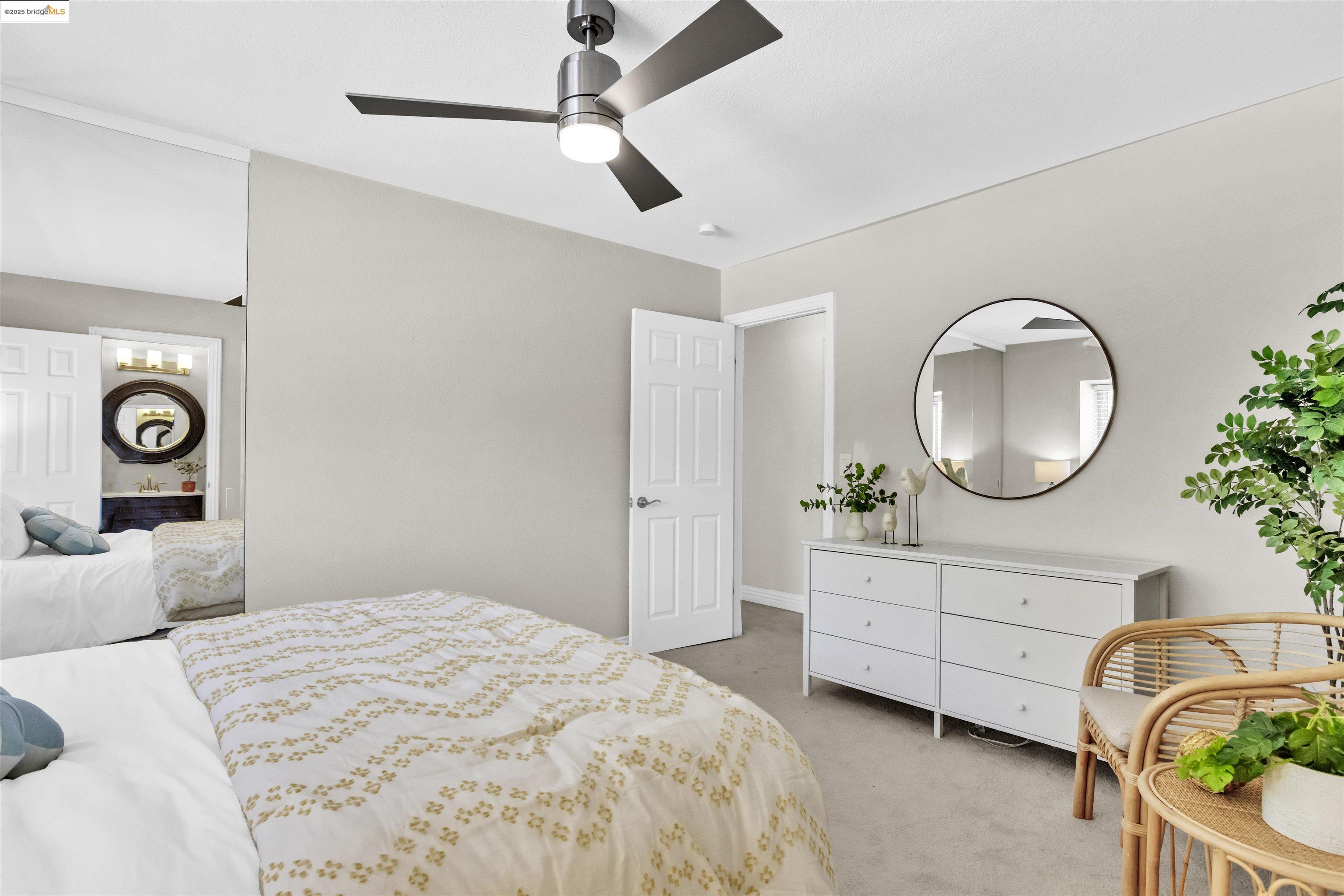 1905 Cannon Place Walnut Creek, CA 94597 - Photo 27 of 40 a bedroom with a bed mirror and a window