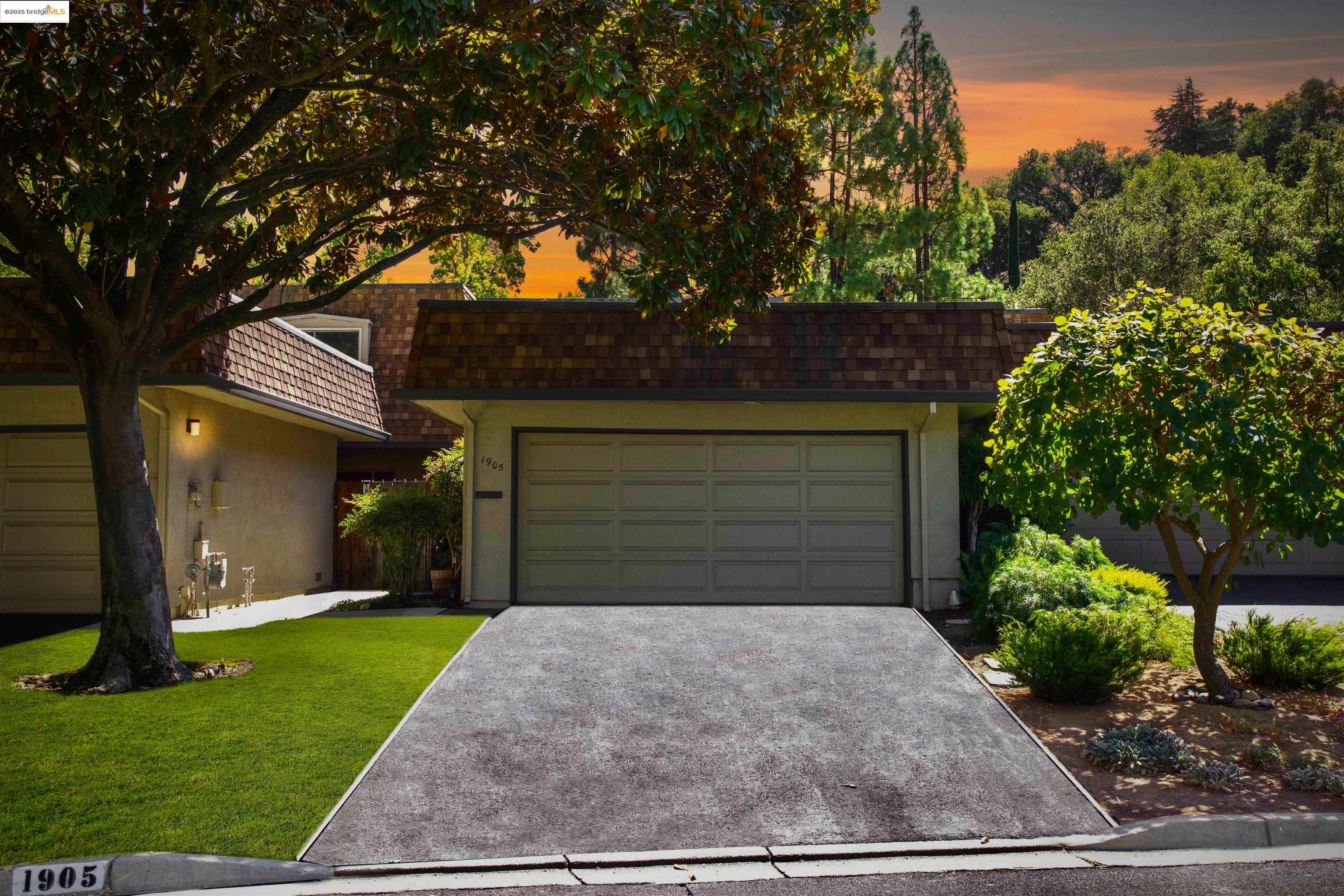 1905 Cannon Place Walnut Creek, CA 94597 - Photo 29 of 40 a front view of a house with a yard and garage
