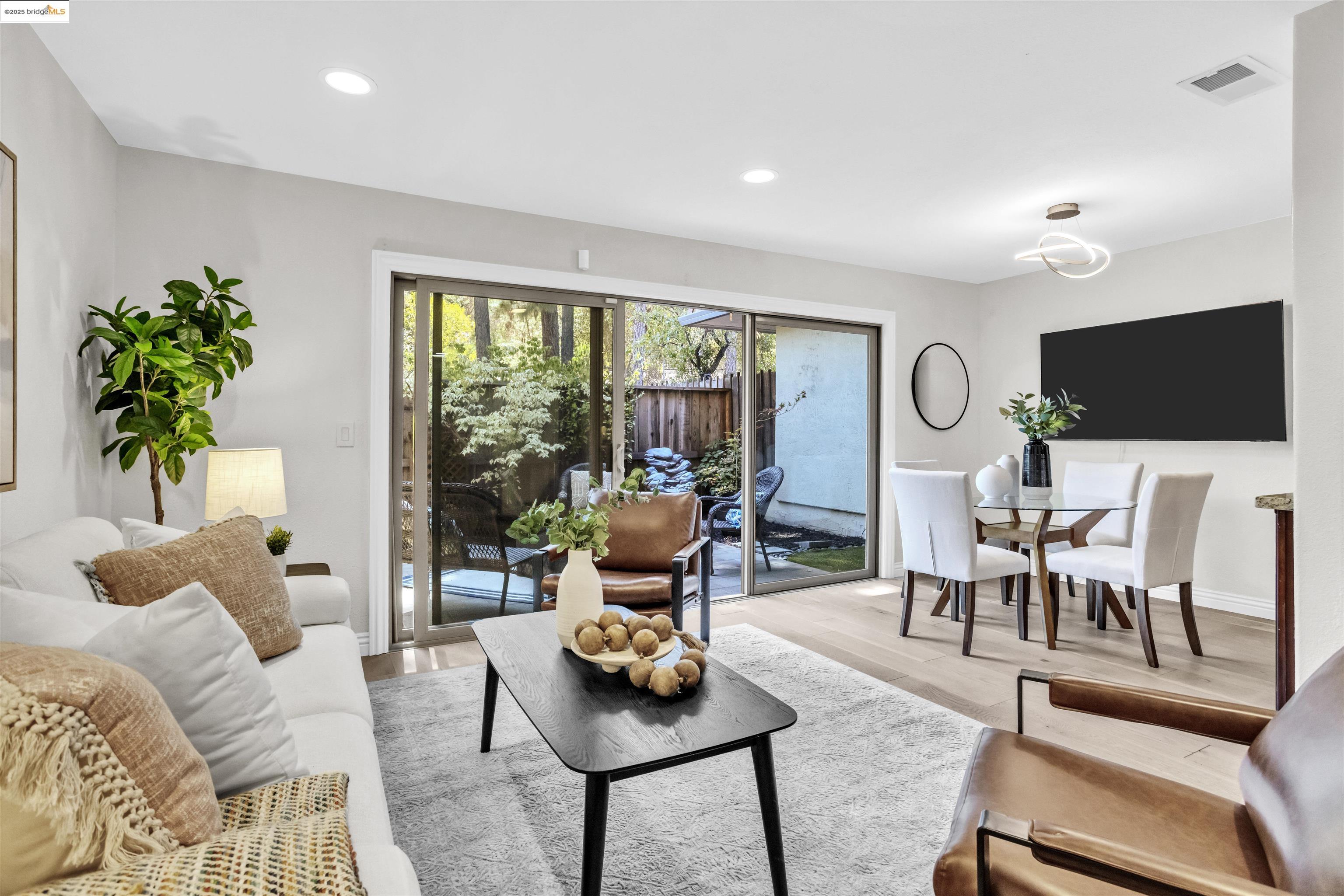 1905 Cannon Place Walnut Creek, CA 94597 - Photo 3 of 40 a living room with furniture and a flat screen tv