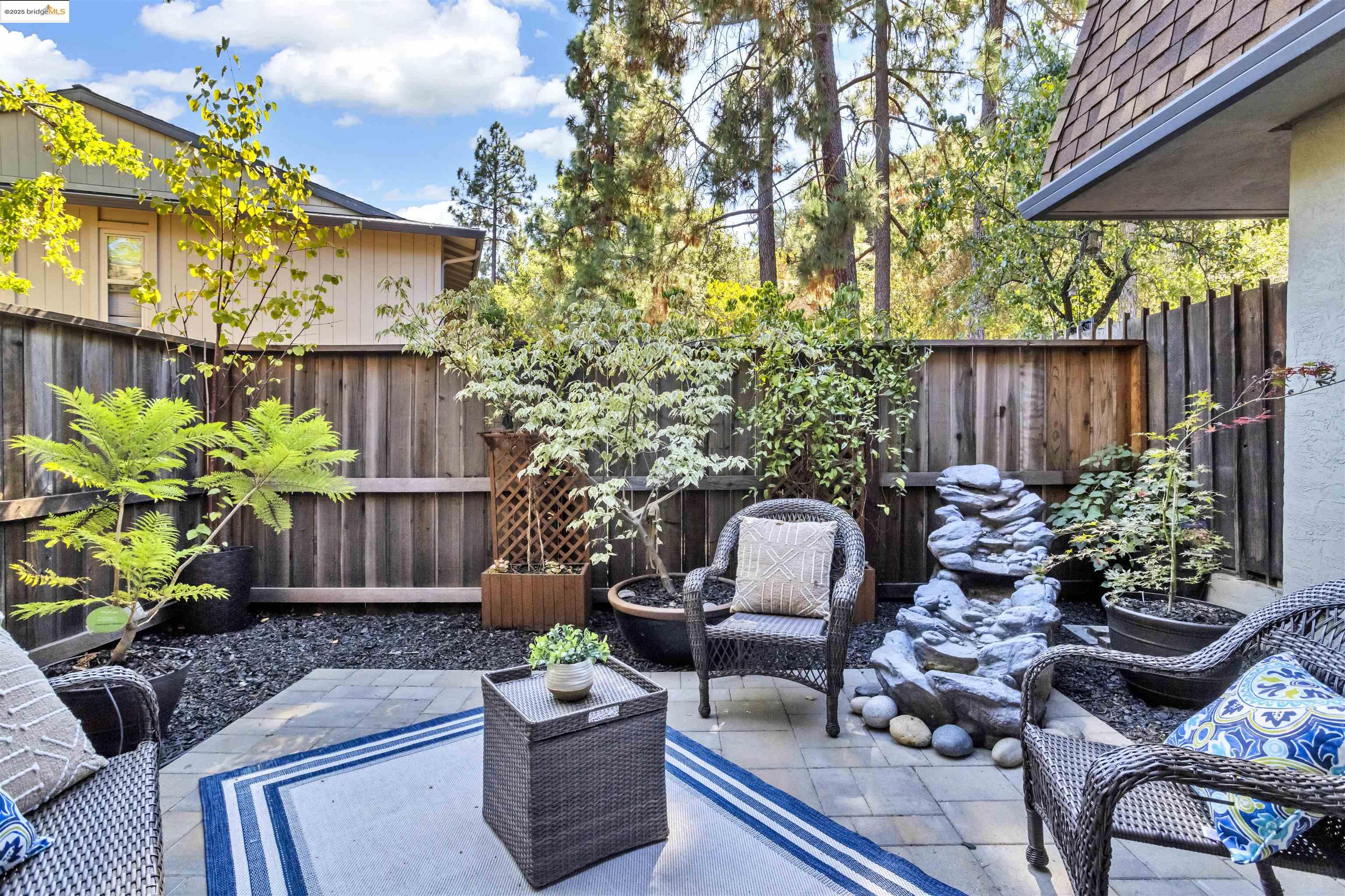 1905 Cannon Place Walnut Creek, CA 94597 - Photo 4 of 40 a view of a backyard with furniture potted plants and wooden fence