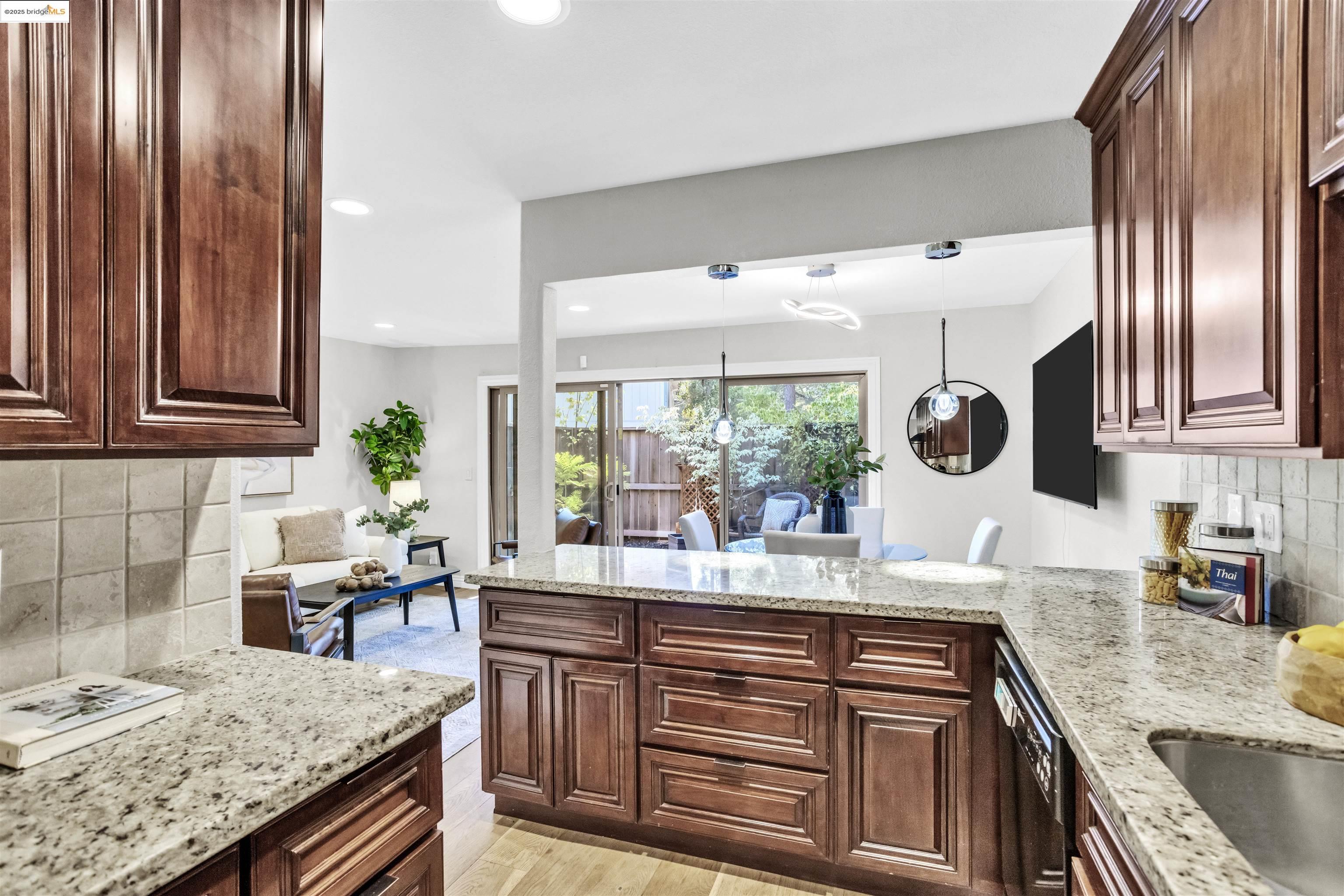 1905 Cannon Place Walnut Creek, CA 94597 - Photo 10 of 40 a kitchen with granite countertop stainless steel appliances a sink and a counter space