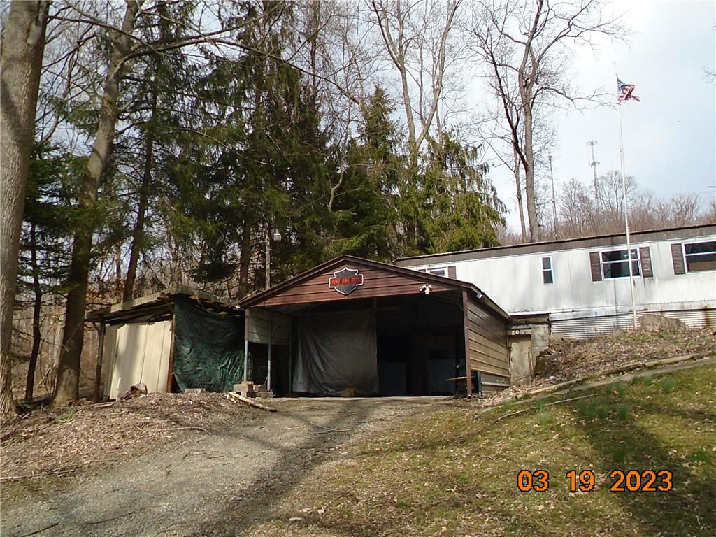 400 Bell Point Road Avonmore, PA 15618 - Photo 3 of 20 a front view of a house with a yard and garage