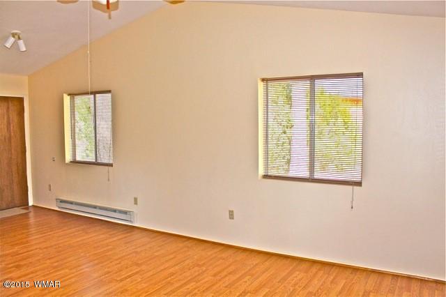2919 Red Cinder Road Overgaard, AZ 85933 - Photo 3 of 28 an empty room with a window