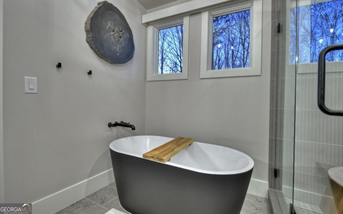 375 Blue Berry Ridge, Unit 2B Morganton, GA 30560 - Photo 13 of 61 a white bath tub sitting in a bathroom