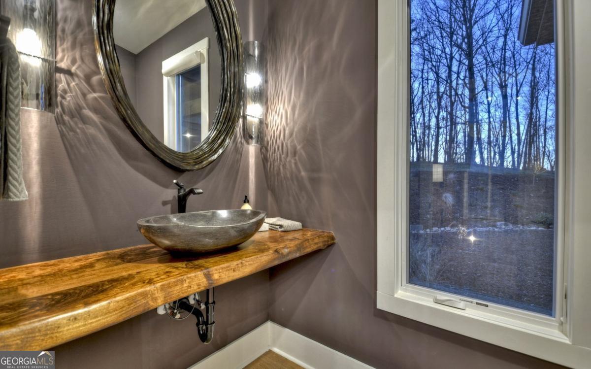 375 Blue Berry Ridge, Unit 2B Morganton, GA 30560 - Photo 15 of 61 a bathroom with a mirror and a sink