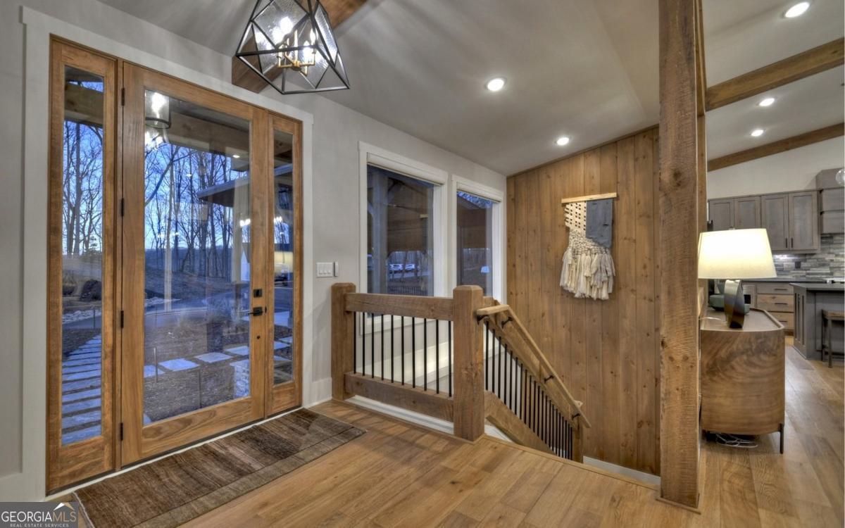 375 Blue Berry Ridge, Unit 2B Morganton, GA 30560 - Photo 18 of 61 a view of a hallway with wooden floor and stairs
