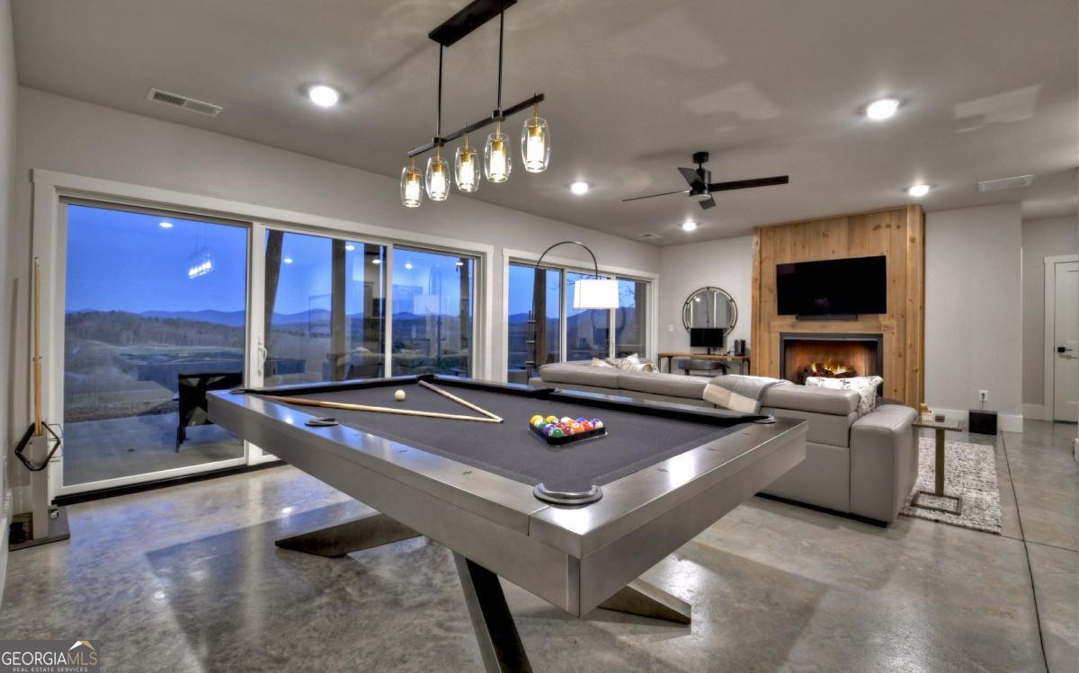 375 Blue Berry Ridge, Unit 2B Morganton, GA 30560 - Photo 21 of 61 a living room with furniture and a flat screen tv