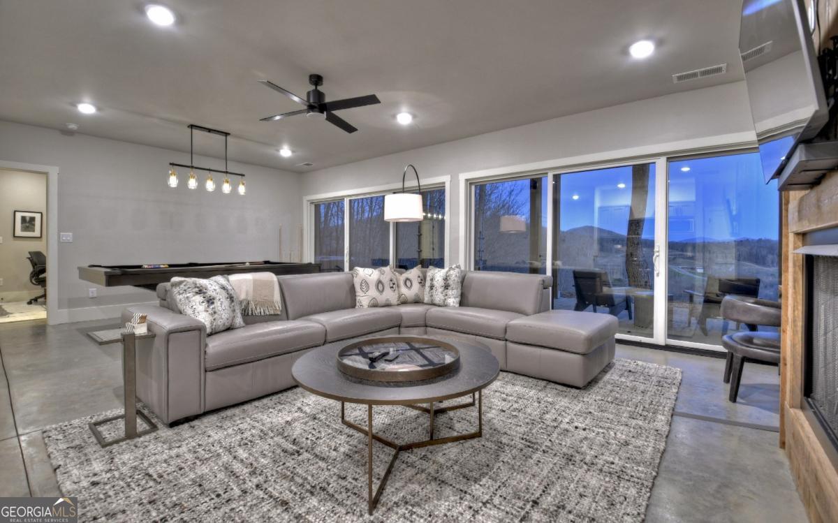 375 Blue Berry Ridge, Unit 2B Morganton, GA 30560 - Photo 22 of 61 a living room with furniture and a large window