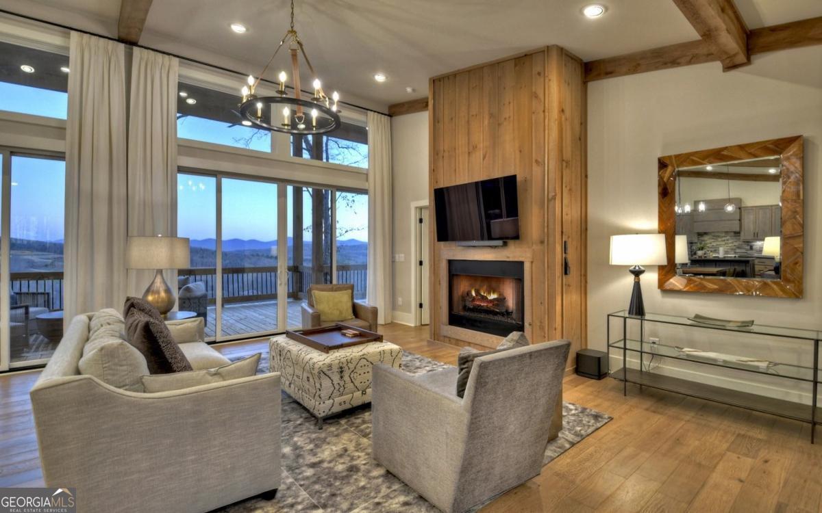 375 Blue Berry Ridge, Unit 2B Morganton, GA 30560 - Photo 4 of 61 a living room with fireplace furniture and a flat screen tv