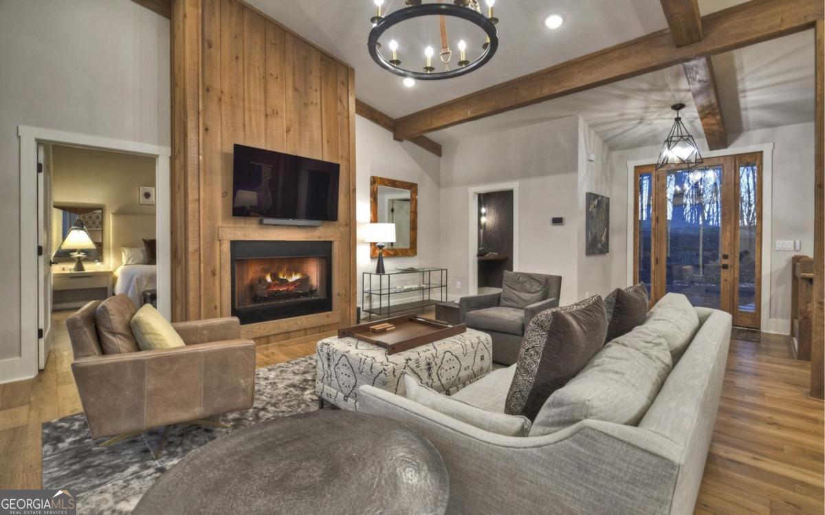 375 Blue Berry Ridge, Unit 2B Morganton, GA 30560 - Photo 42 of 61 a living room with furniture and a fireplace