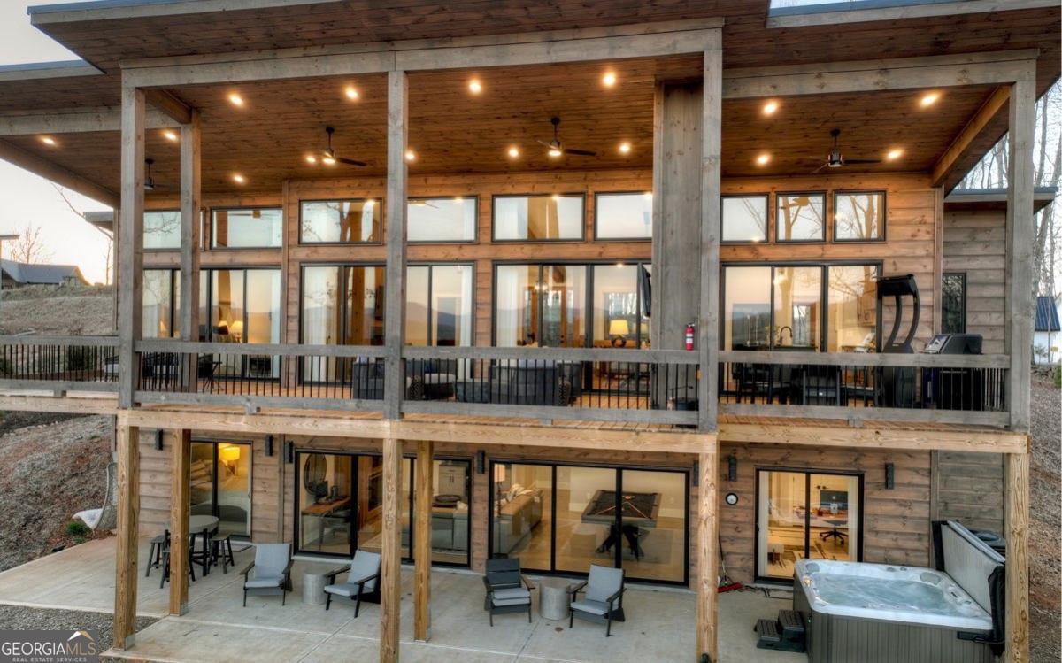 375 Blue Berry Ridge, Unit 2B Morganton, GA 30560 - Photo 44 of 61 a dining area with glass top table and chairs