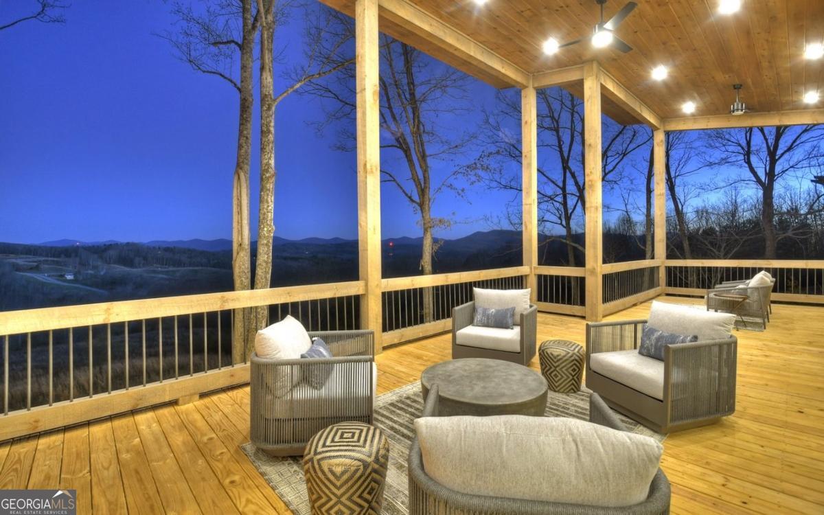 375 Blue Berry Ridge, Unit 2B Morganton, GA 30560 - Photo 51 of 61 a balcony with furniture and wooden floor